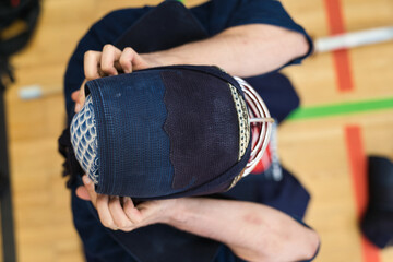 Kenjutsu Kendo Fighter in preparation for the next fight wearing traditional kendo suits