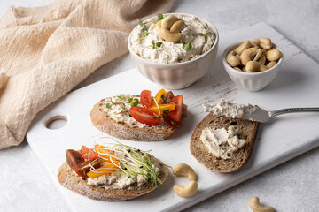 Sandwiches with cashew cream cheese on white background.
