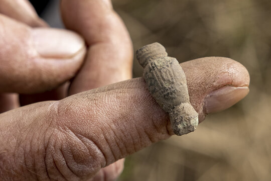 Iron Age Fibula On A Dirty Finger