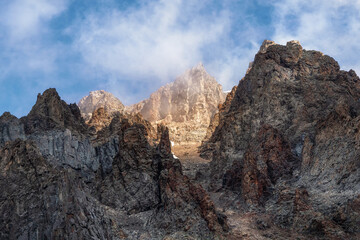 Naklejka na ściany i meble Gorge in the highlands, a narrow path among the rocks, mystical mountains.