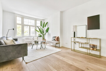 Stylish living room with large sofa and round designer coffee table