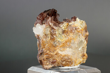Macro minerals Axinite stone on a gray background