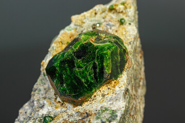 macro mineral stone Andradite on a black background