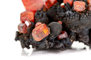 Macro mineral stone Vanadinite on a white background