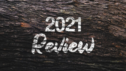 2021 Review incription on wood background