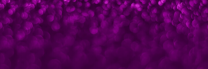 Velvet violet sparkling glitter background, christmas texture. Holiday lights. Abstract defocused header. Wide screen wallpaper. Panoramic web banner with copy space for design