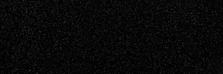 Black and white sparkling glitter bokeh background, christmas shiny texture. Holiday lights. Abstract defocused header. Wide screen wallpaper. Panoramic web banner with copy space for design