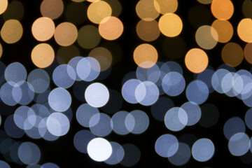 Defocused christmas lights. Blue and yellow. Bokeh. Copy space