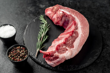 raw pork ribs on a stone background