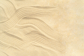 Drawing of waves on the sand on the beach, sand pattern