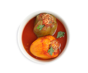Delicious stuffed peppers with parsley in bowl isolated on white, top view
