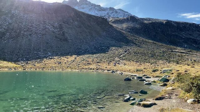 Amazing turquoise Hirscheben lake with nice reflections and great mountains in the background, very close to K&uuml;htai in Tyrol, Austria