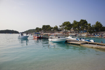 Fototapeta na wymiar Speedboats near the pier Ksamil, Albania