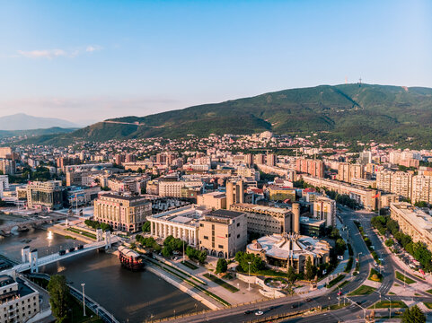 skopje drone, drone shot, street, culture, history, town, structure, downtown, stone, statue, attraction, monument, center, museum, city landscape, water river, summer, stone bridge, skopje macedonia,