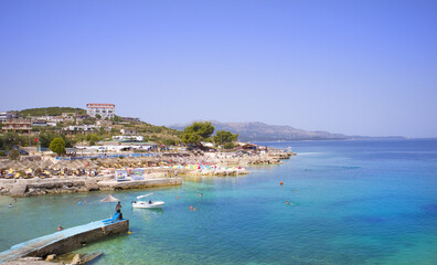 Naklejka na ściany i meble Beach with azure water of the Ionian Sea in Ksamil, Albania 