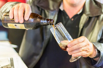 pouring beer in the glass