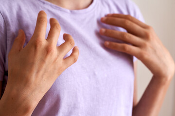 Teenager practicing EFT tapping on the collarbone point