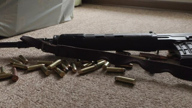 weapons and ammunition close-up on the carpet