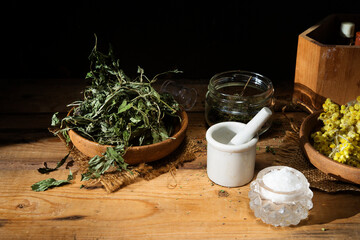 ingredients for homemade bath salts preparation, dried herbs and flowers