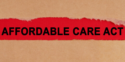 Among the torn sheets of paper on a red background, the inscription - Affordable Care Act