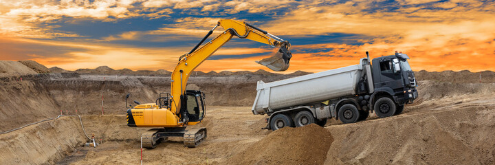 digger and excavator at work in construction site