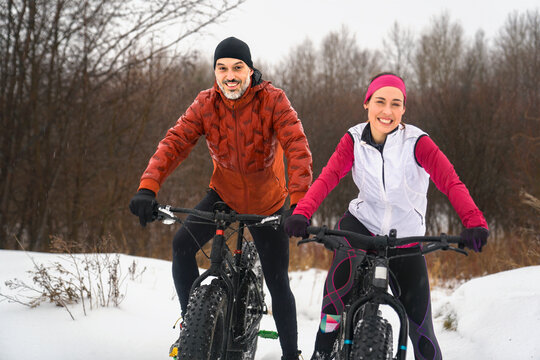 Couple Mountain Biking on Fat Bikes in the winter © Louis-Photo 