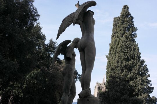 Incredible post modern sculpture figure of angels with wings. Art bronze atmospheric installation, human truncated torso body, Mitoraj. Scenery for immersion in history unique ancient Pompeii, Italy