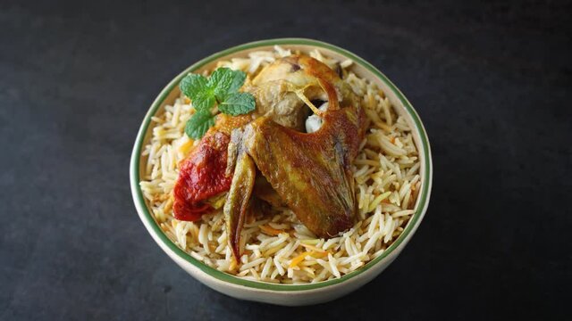 Arabic chicken Manthi mandi cooked meat, Basmati rice with Masala, spice. Kuzhimanthi hot spicy Manthi black background 4K video footage Malabar Kerala, South India. Top view of Indian non veg food.