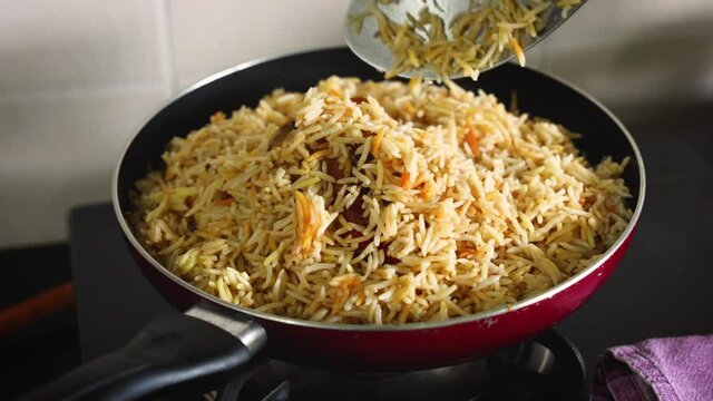 Arabic chicken Manthi mandi cooked meat Basmati rice with Masala spice woman hand serving cooking Kuzhimanthi hot spicy Manthi 4K video footage Malabar Kerala South India Indian non veg food Sri Lanka