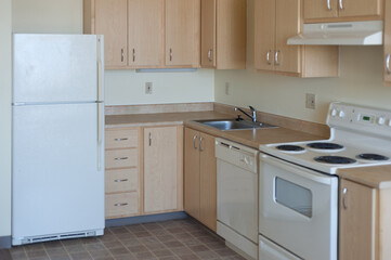 A cheap, low end apartment kitchen. - obrazy, fototapety, plakaty