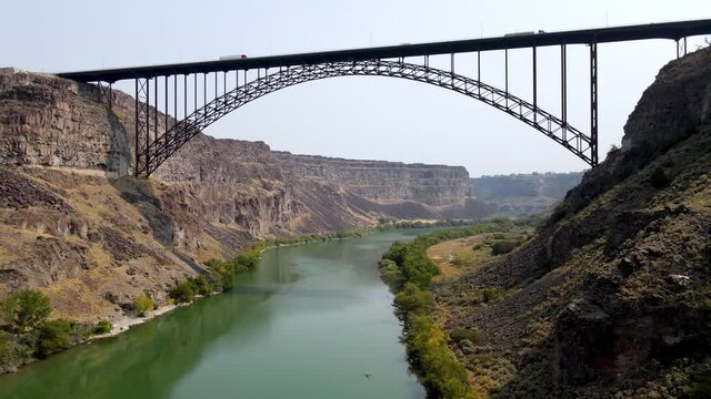 Aerial view of the Perrine Memorial Bridge over the snake river in Twin Falls, Idaho. With cars driving across the bridge.