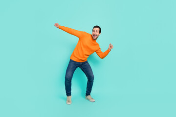 Full body portrait of childish cheerful person enjoy dancing clubbing isolated on teal color background