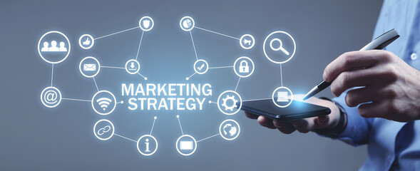 Human holding smartphone with a Marketing Strategy concept.