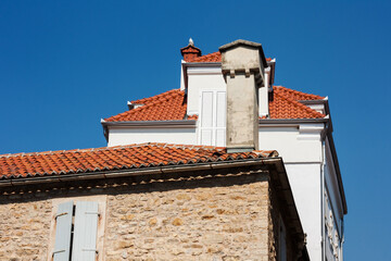 Street and landscape of Old town Budva, Montenegro: medieval city, ancient walls and red tiled roof, beautiful view