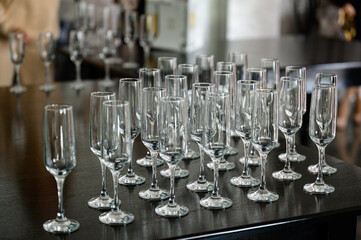 Serving champagne glasses at a solemn event.