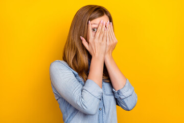 Photo of stressed small brown hairdo girl close face wear denim shirt isolated on bright yellow color background