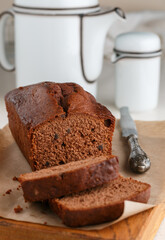 Homemade freshly baked chocolate pound cake loaf. Delicious homemade dessert. Slices on a cutting board. Selective focus