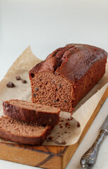 Homemade freshly baked chocolate pound cake loaf. Delicious homemade dessert. Slices on a cutting board. Selective focus, copy space - 475144792