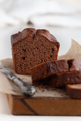 Homemade freshly baked chocolate pound cake loaf. Delicious homemade dessert. Slices on a cutting board. Selective focus, copy space