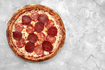 Homemade cheese pizza with salami, delicious pizza with cheddar. pepperoni pizza