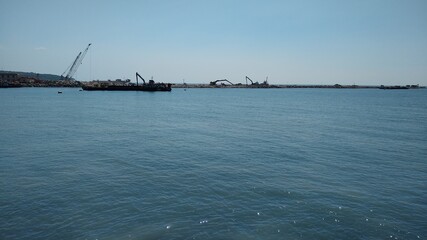 Vizhinjam sea port, Thiruvananthapuram, Kerala, seascape view, blue sky background