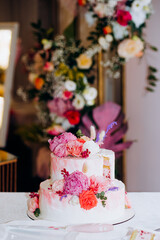 Wedding cake bride and groom with pink peonies