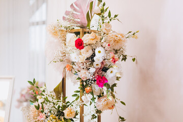 Decoration of the wedding hall with flowers in pink and white shades