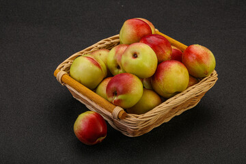 Sweet small nectarines in the basket