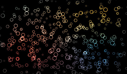 Vector illustration. Bright glowing particles of different colors on a black background. Christmas sparks
