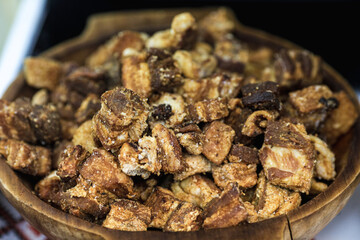 Shallow depth of field (selective focus) image with traditional Romanian winter holidays meat foods(jumari) for sale in an outdoors market in Bucharest, Romania.