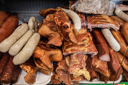 Shallow depth of field (selective focus) image with traditional Romanian winter holidays meat foods for sale in an outdoors market in Bucharest, Romania.