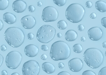 Blue doses of acid, hyaluronic moisturizing serum or gel on a monochrome background. Abstract backdrop pattern. Beauty product wallpaper. Cosmetics or healthcare protection concept. 