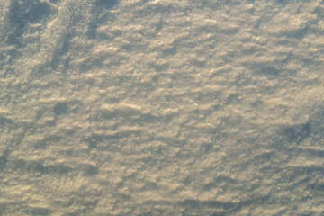 Uneven texture of snow in the sunset light