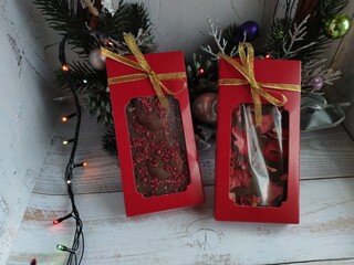 Chocolate with strawberries in a festive package. Delicious gift. Handmade chocolate.	
